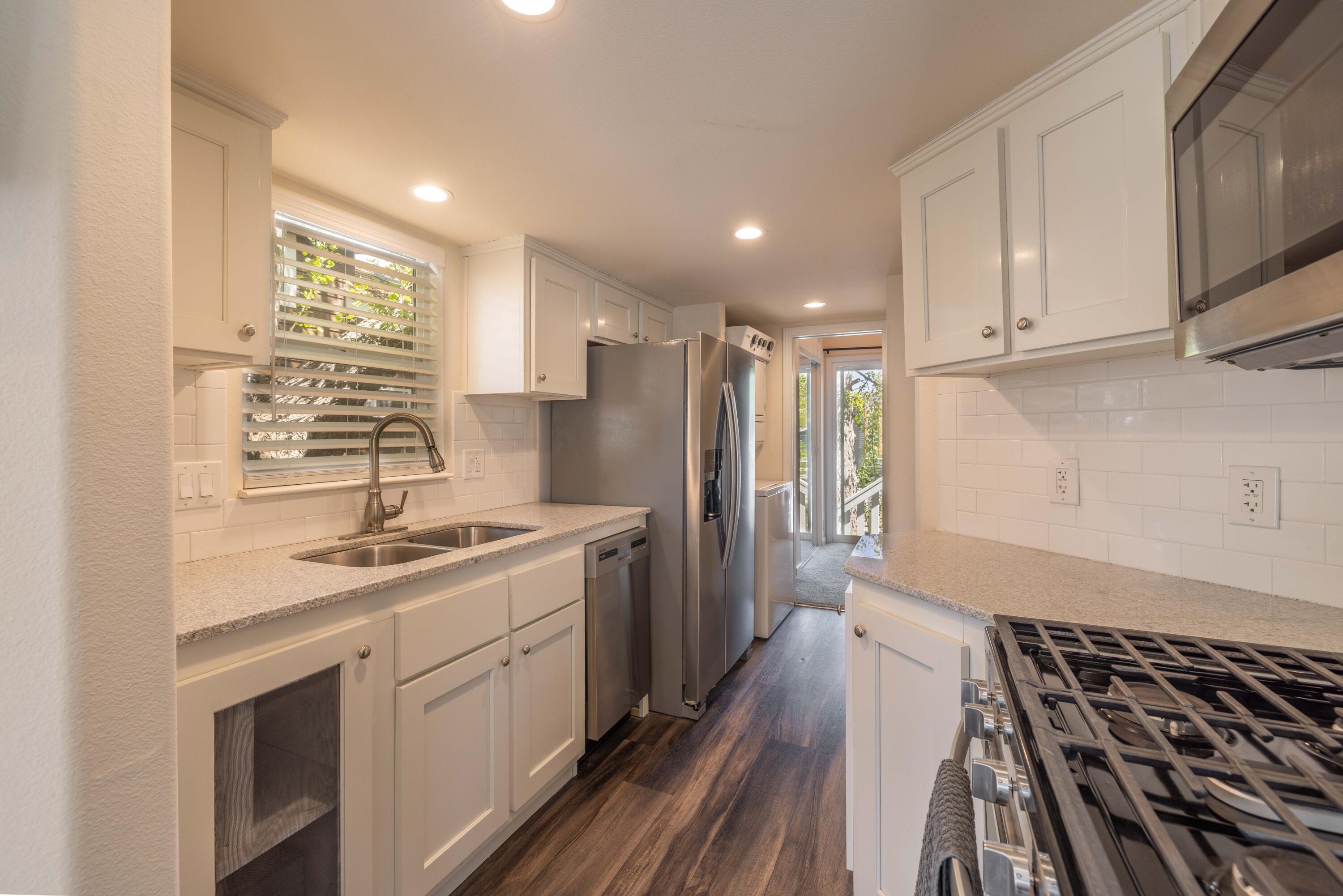 547 Alden Road, Unit RV4 Big Bear Lake, CA 92315 - Photo 11 of 38 a kitchen with a sink stove and refrigerator