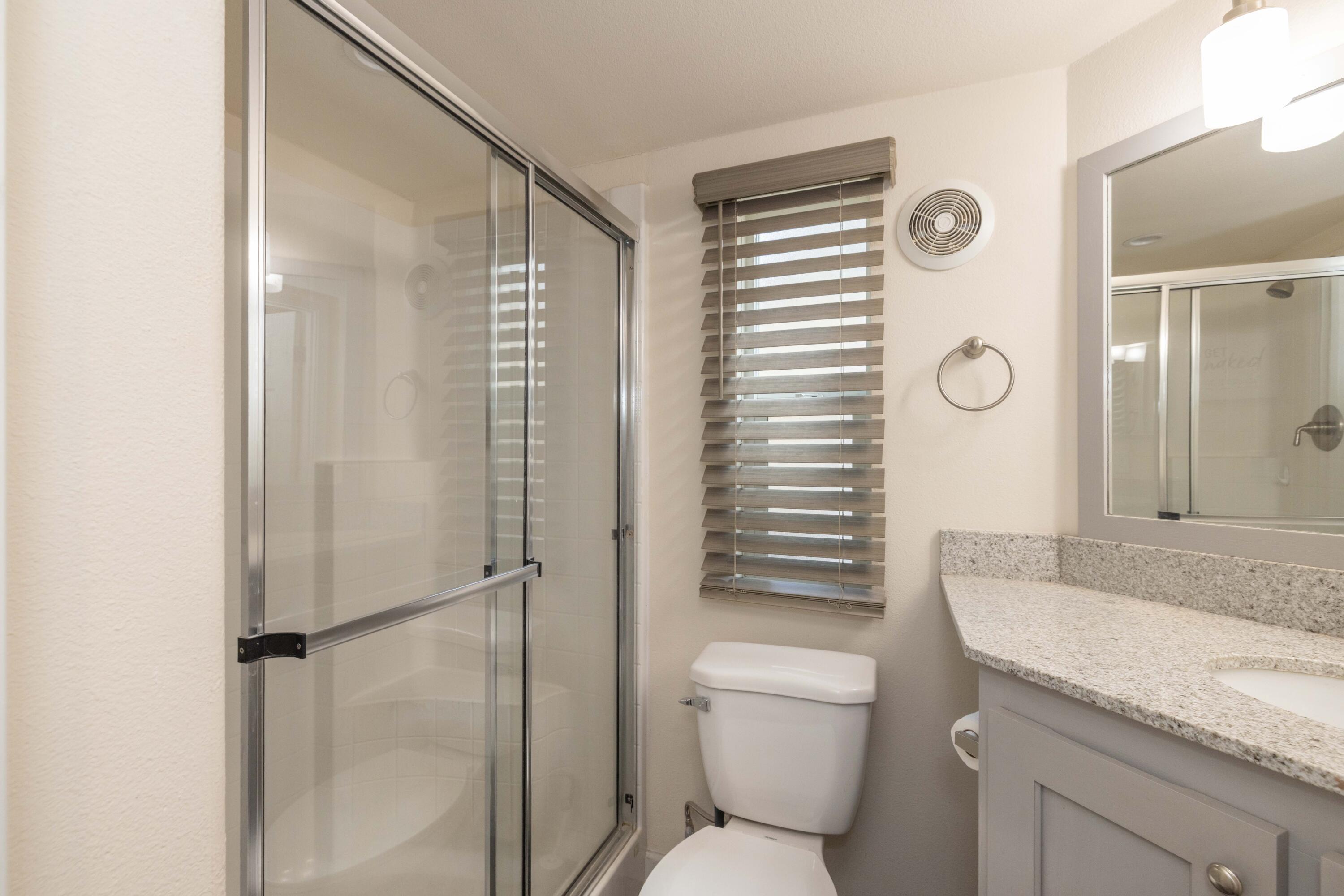 547 Alden Road, Unit RV4 Big Bear Lake, CA 92315 - Photo 12 of 38 a bathroom with a granite countertop sink toilet and shower