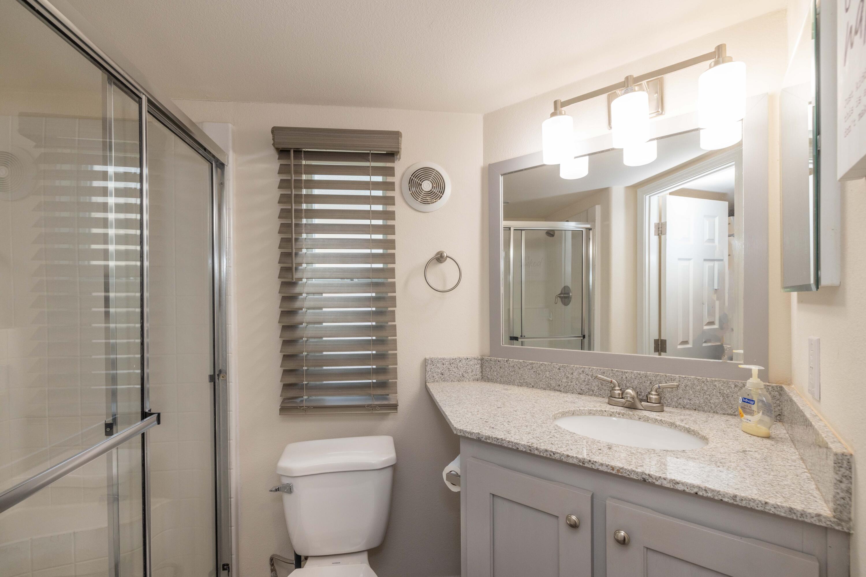 547 Alden Road, Unit RV4 Big Bear Lake, CA 92315 - Photo 13 of 38 a bathroom with a granite countertop sink toilet and shower