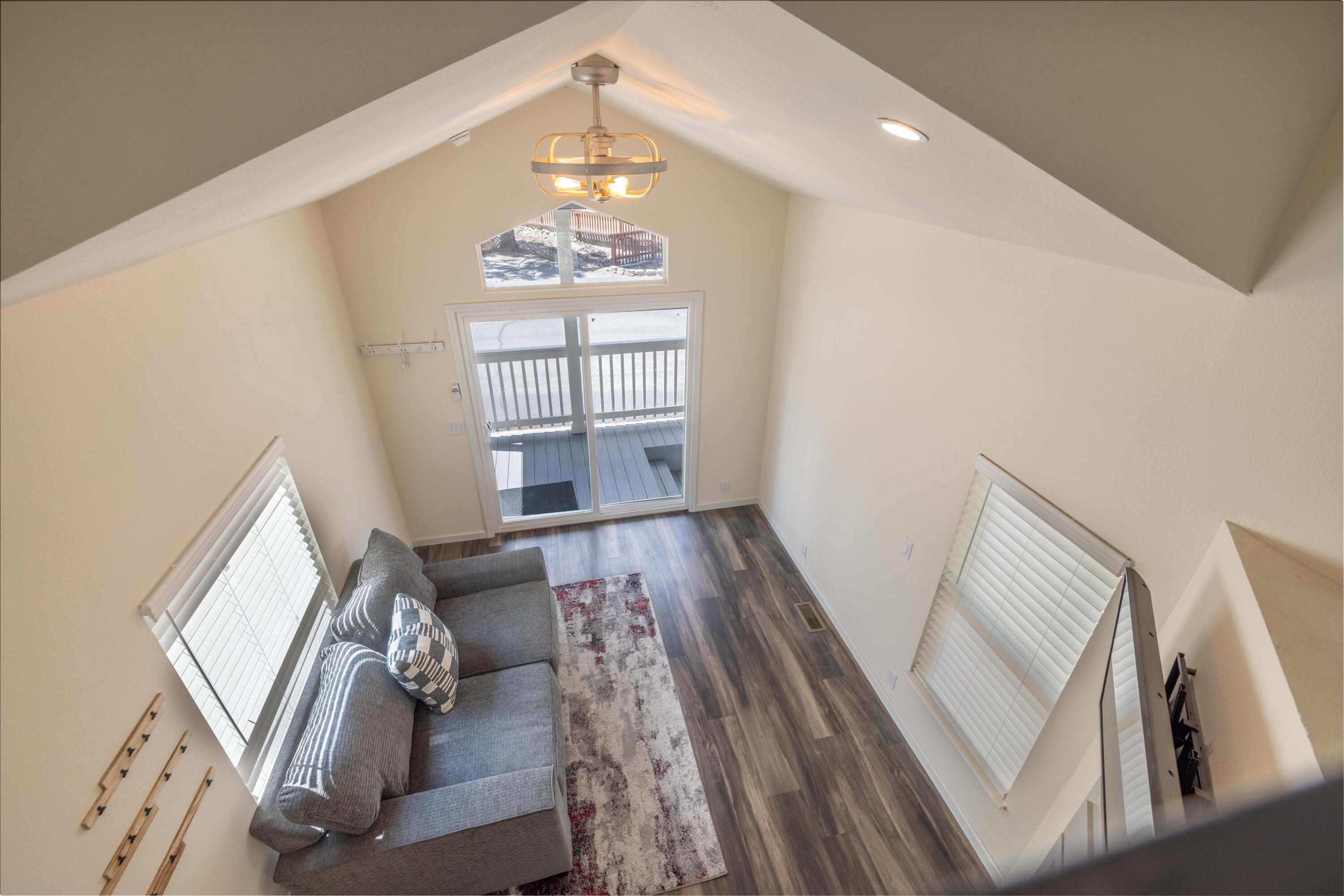 547 Alden Road, Unit RV4 Big Bear Lake, CA 92315 - Photo 15 of 38 a living room with furniture and a chandelier