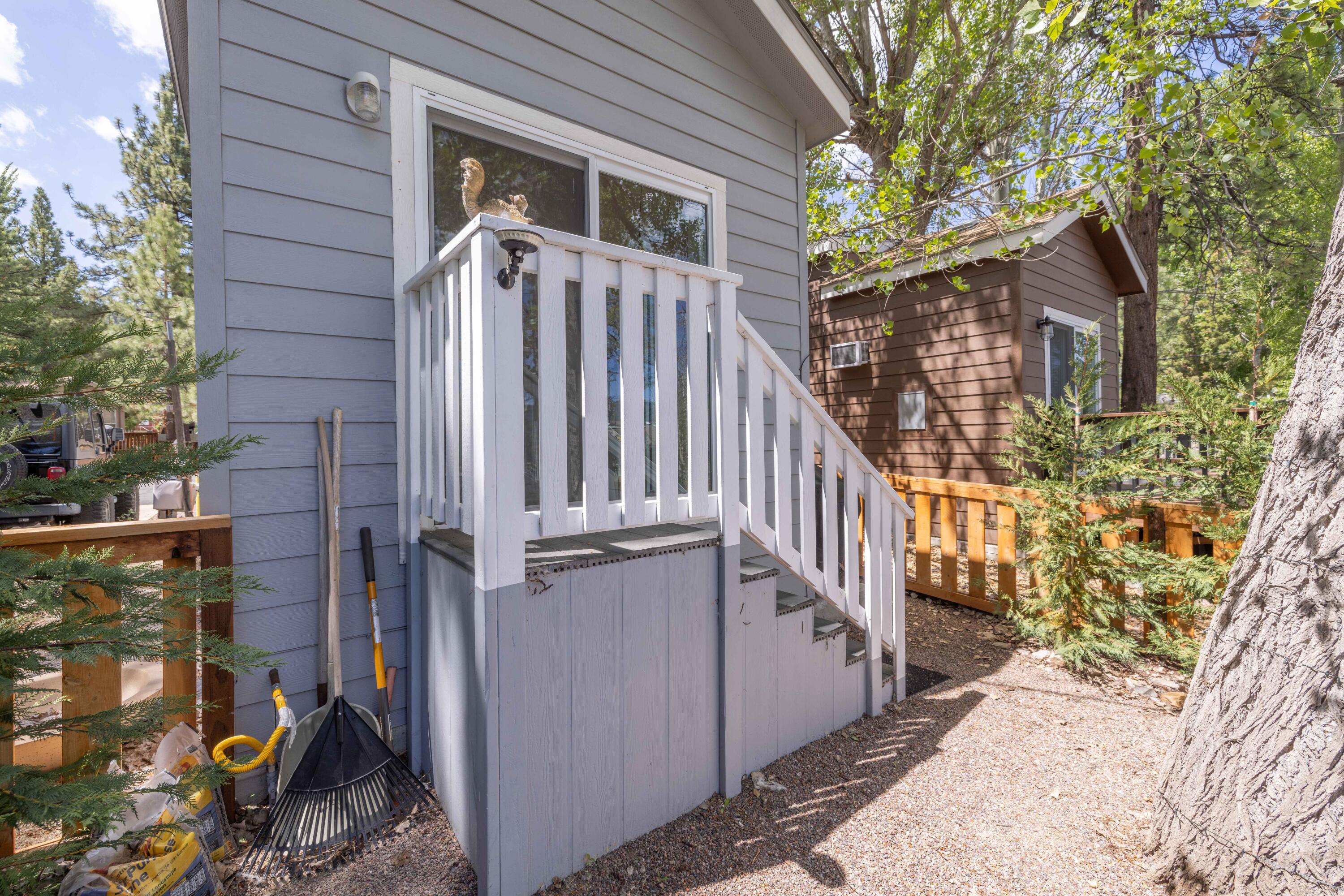 547 Alden Road, Unit RV4 Big Bear Lake, CA 92315 - Photo 21 of 38 a view of a house with wooden fence