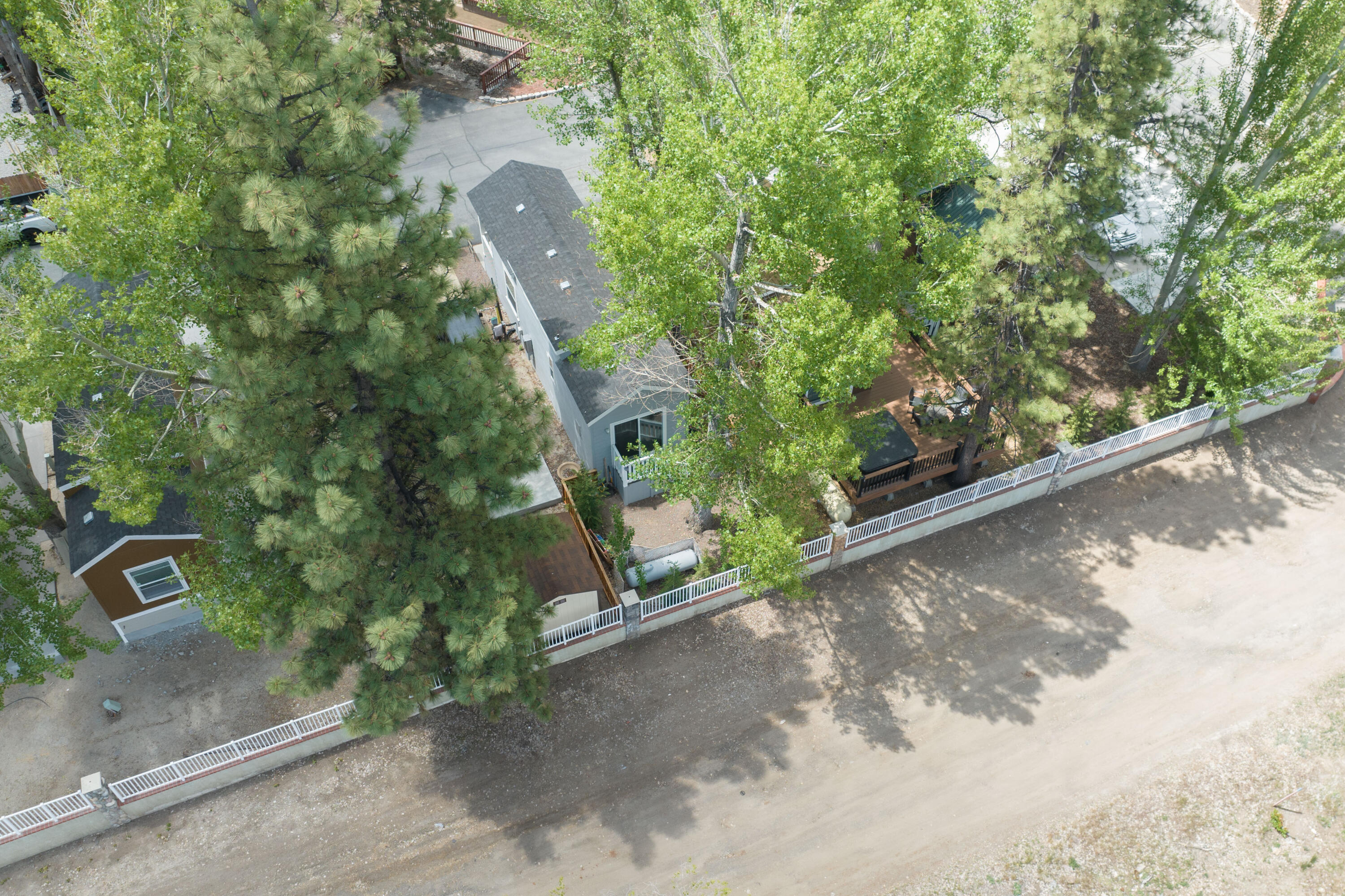 547 Alden Road, Unit RV4 Big Bear Lake, CA 92315 - Photo 24 of 38 a view of a garden with a bench