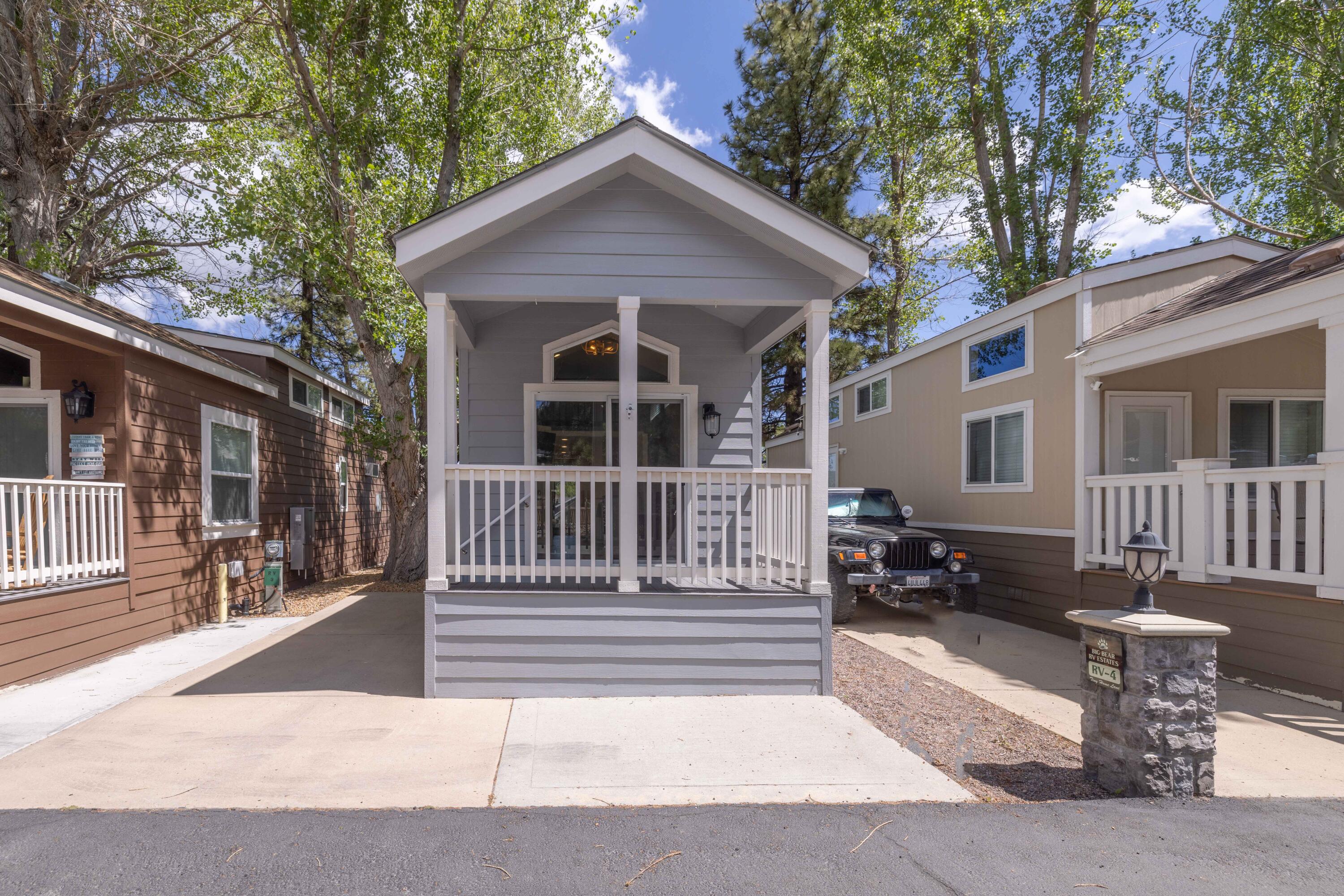 547 Alden Road, Unit RV4 Big Bear Lake, CA 92315 - Photo 28 of 38 a view of a house with a small yard and wooden fence