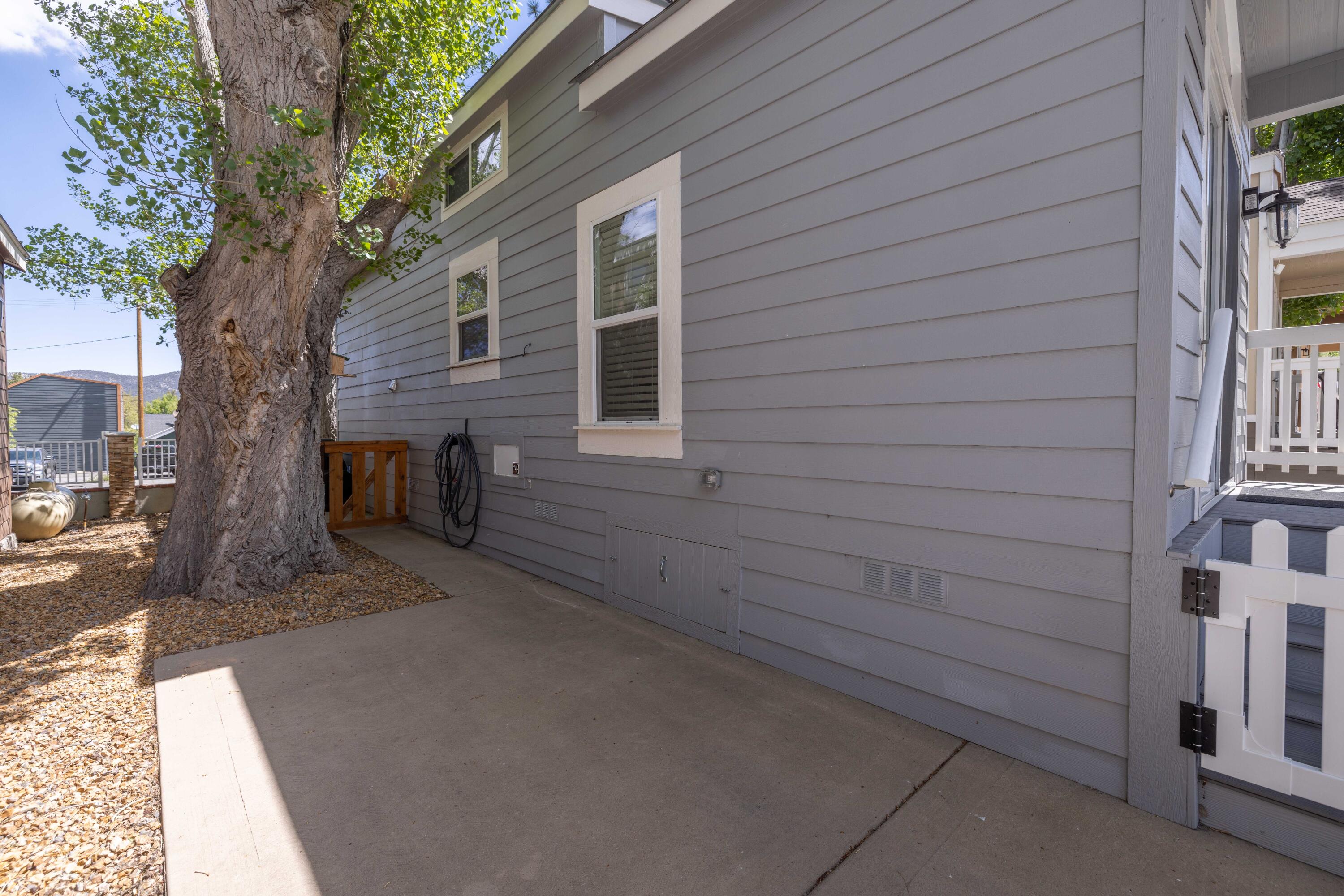547 Alden Road, Unit RV4 Big Bear Lake, CA 92315 - Photo 29 of 38 front view of a house with a tree