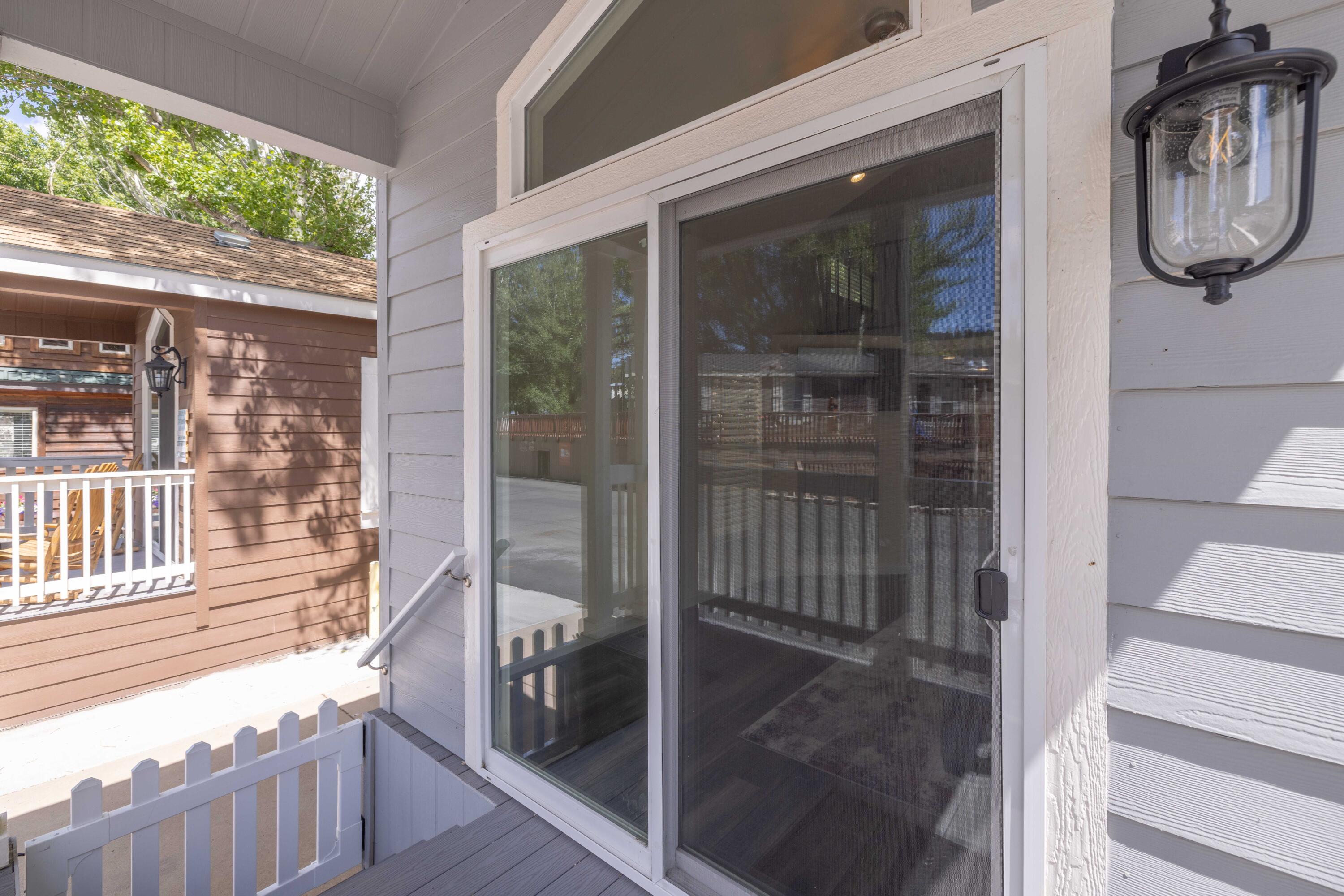 547 Alden Road, Unit RV4 Big Bear Lake, CA 92315 - Photo 32 of 38 a front view of a house with a glass door