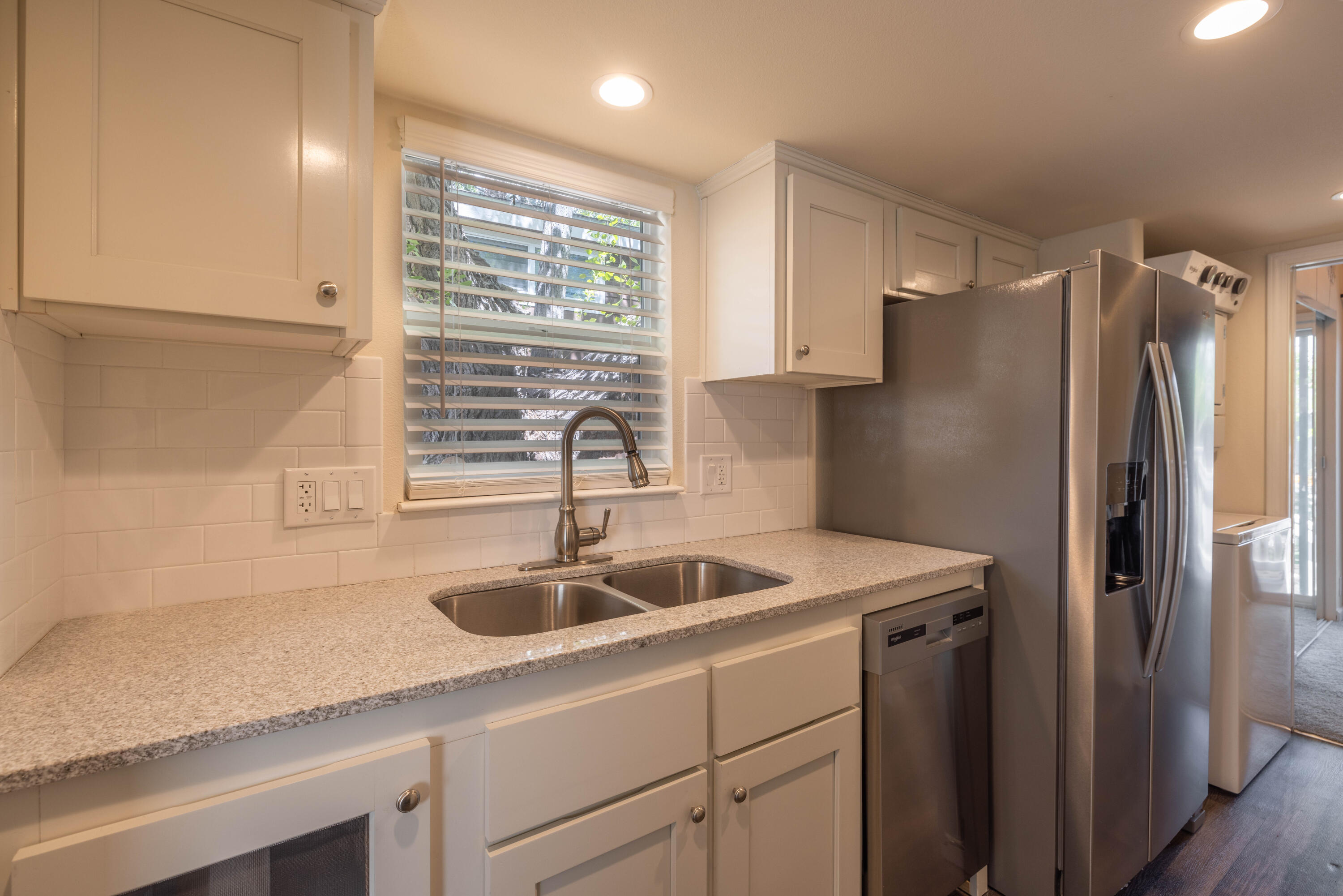 547 Alden Road, Unit RV4 Big Bear Lake, CA 92315 - Photo 33 of 38 a kitchen with stainless steel appliances granite countertop a sink and a refrigerator