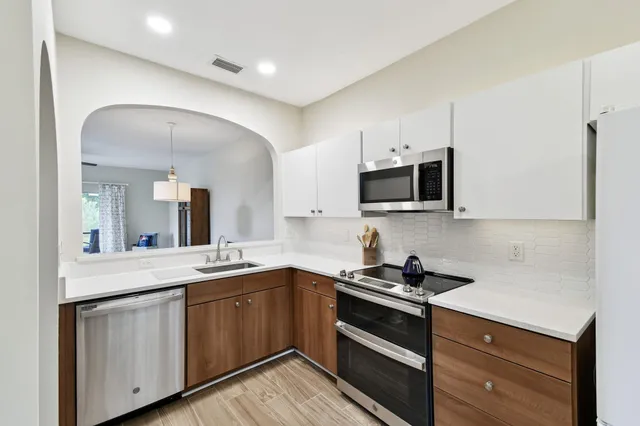 a view of a livingroom with furniture and wooden floor