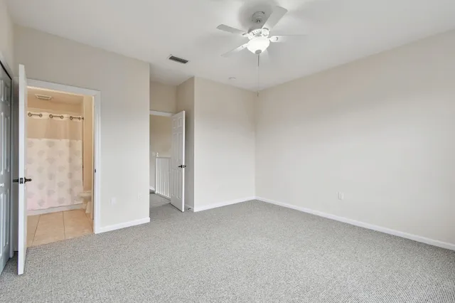 a bathroom with a sink vanity granite and shower