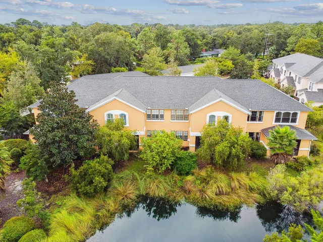 an aerial view of residential houses with outdoor space