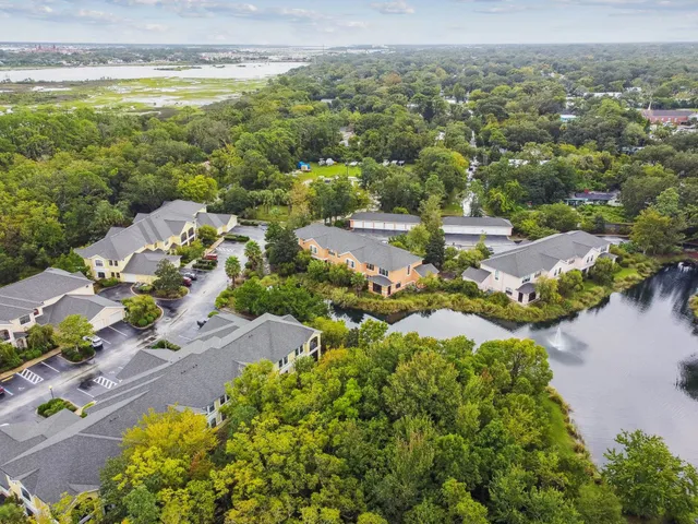 an aerial view of residential houses with outdoor space