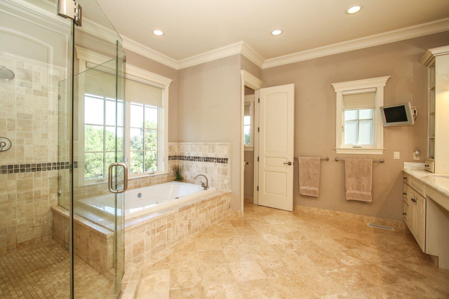 640 Pullman Road Hillsborough, CA 94010 - Photo 17 of 25 a spacious bathroom with a tub sink and mirror