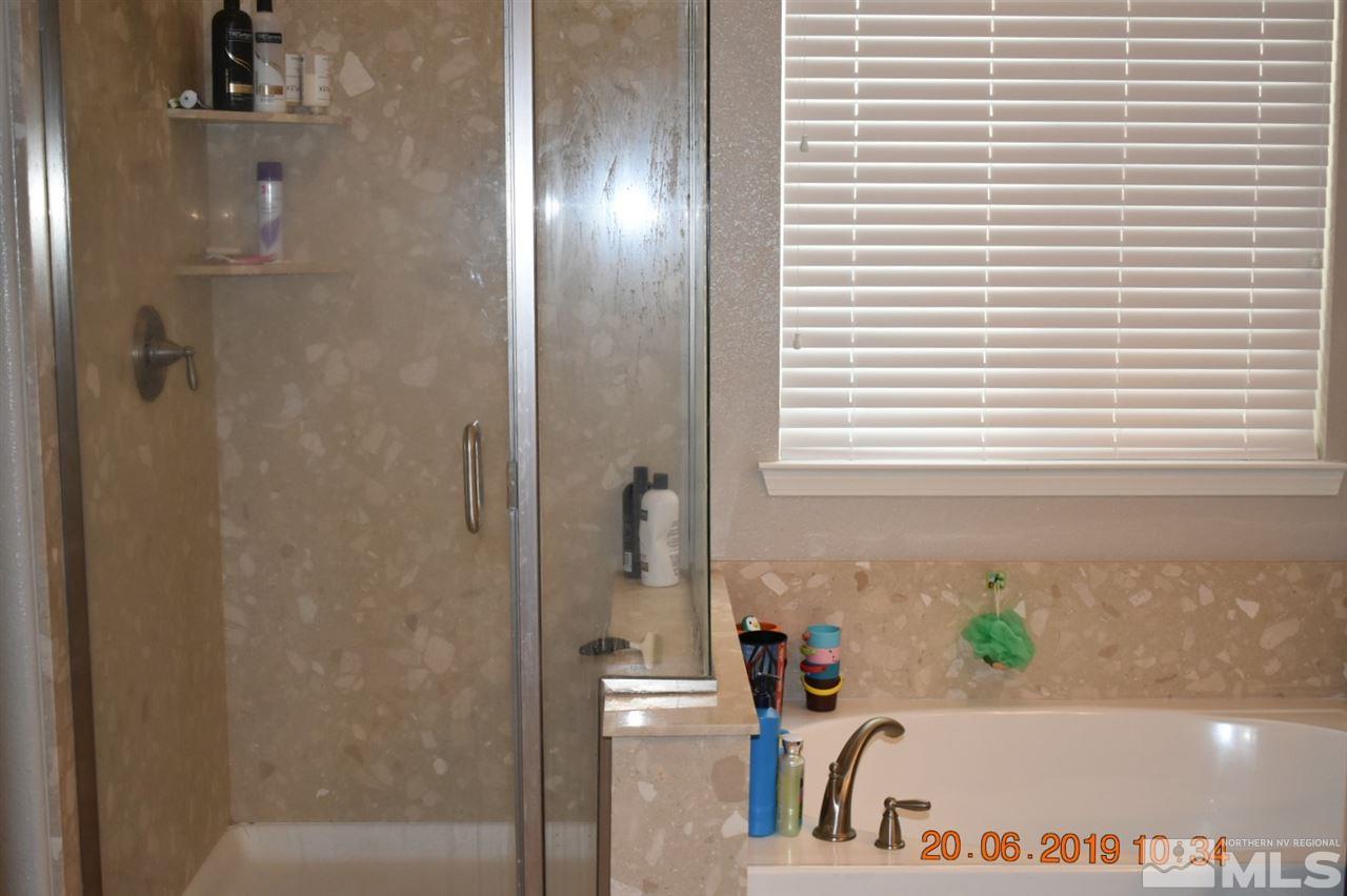 10836 Walnut Ridge Drive Reno, NV 89521 - Photo 17 of 25 a view of bathroom with bathtub and shower