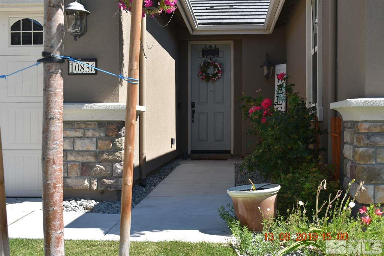 10836 Walnut Ridge Drive Reno, NV 89521 - Photo 25 of 25 a potted plant sitting in front of a house
