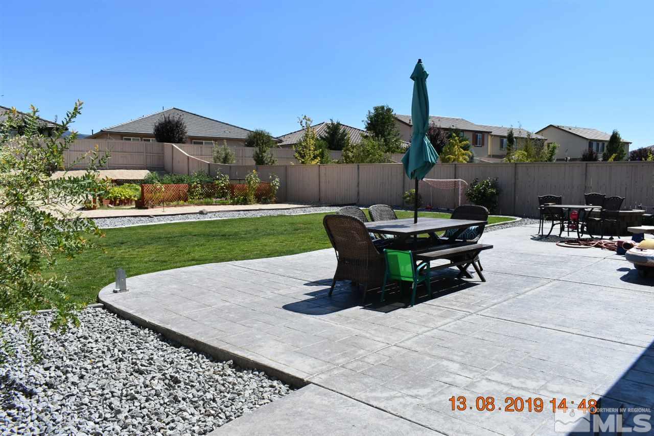 10836 Walnut Ridge Drive Reno, NV 89521 - Photo 8 of 25 a view of a backyard with sitting area