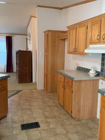 a view of livingroom and kitchen with a sink