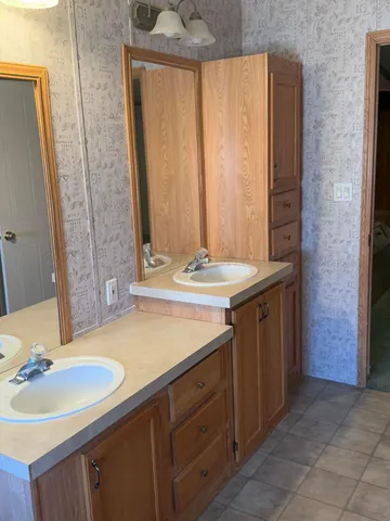 a bathroom with a glass shower door