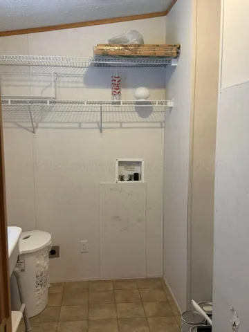 a view of a house with wooden fence