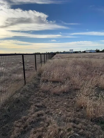 a view of a swimming pool with an outdoor space and seating area