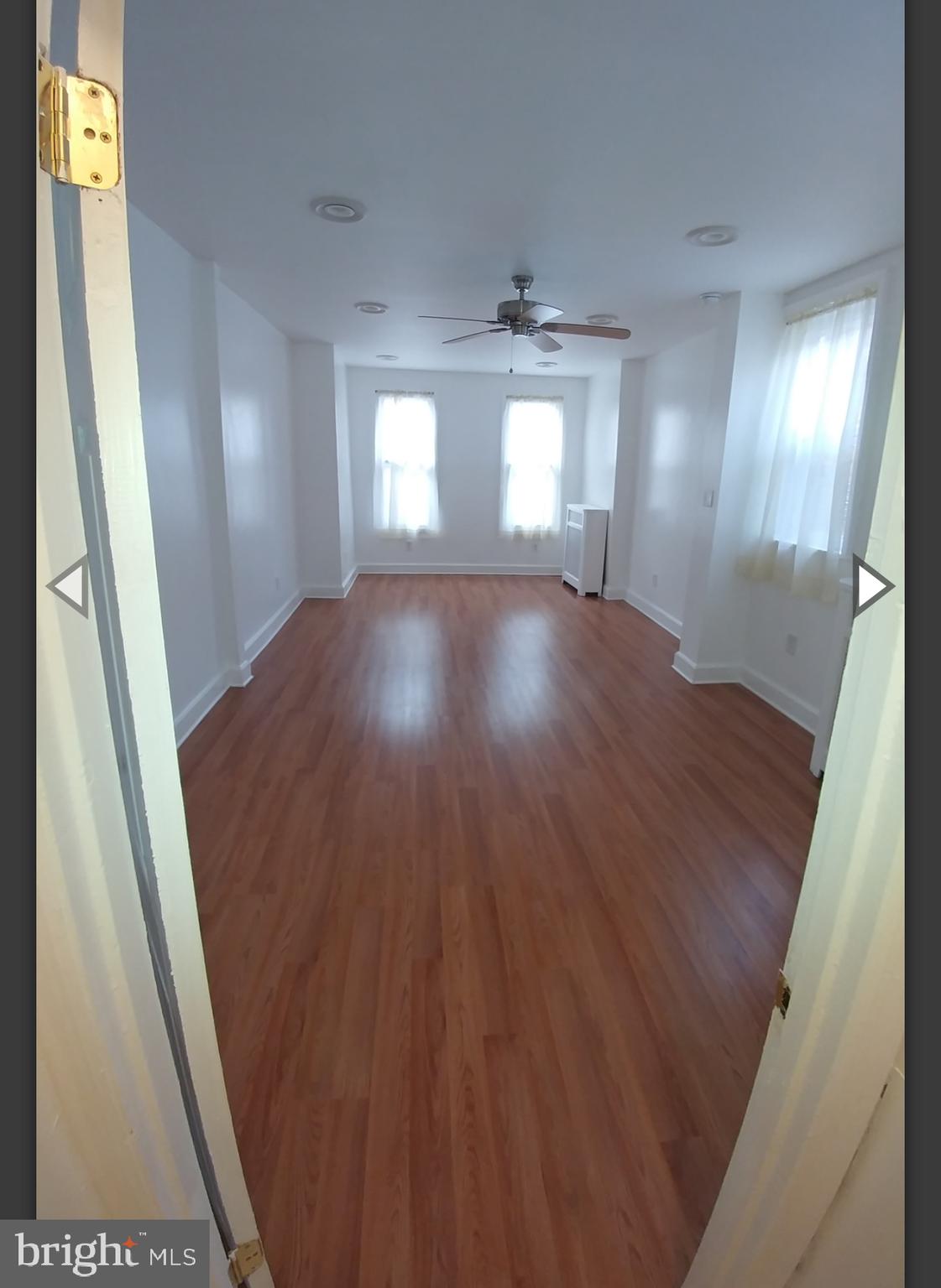 530 West Ritner Street Philadelphia, PA 19148 - Photo 4 of 11 wooden floor in an empty room with a window