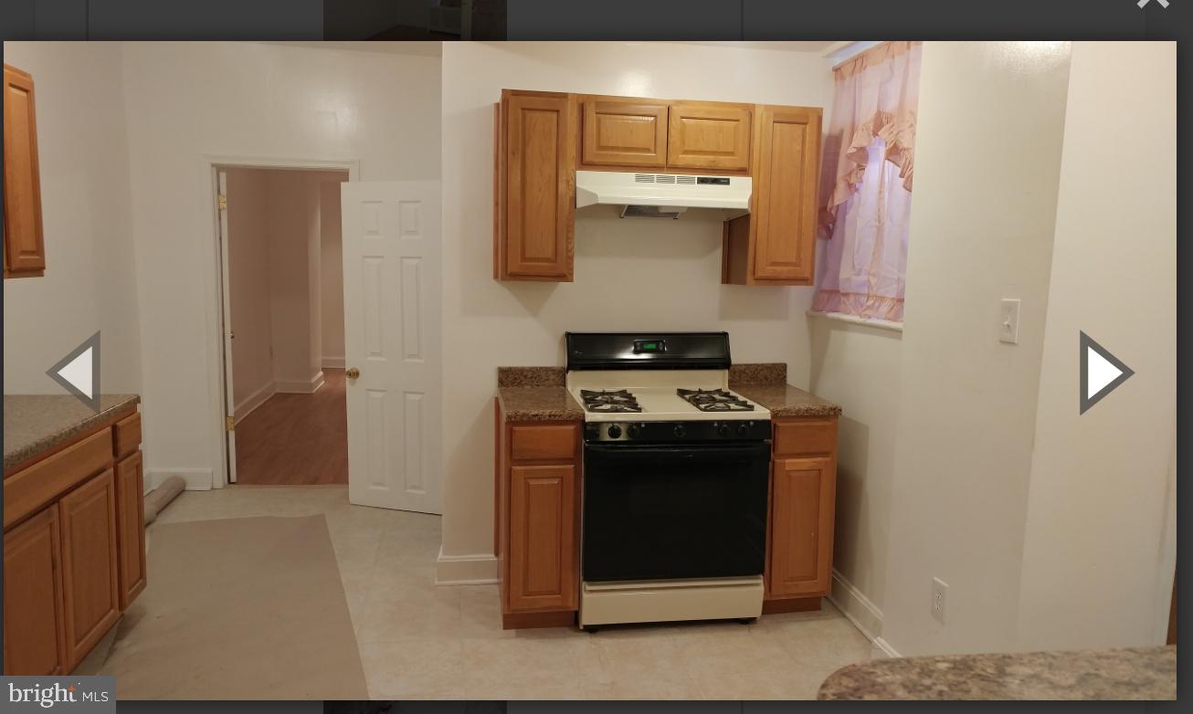 530 West Ritner Street Philadelphia, PA 19148 - Photo 8 of 11 a kitchen with stainless steel appliances granite countertop a stove and a refrigerator