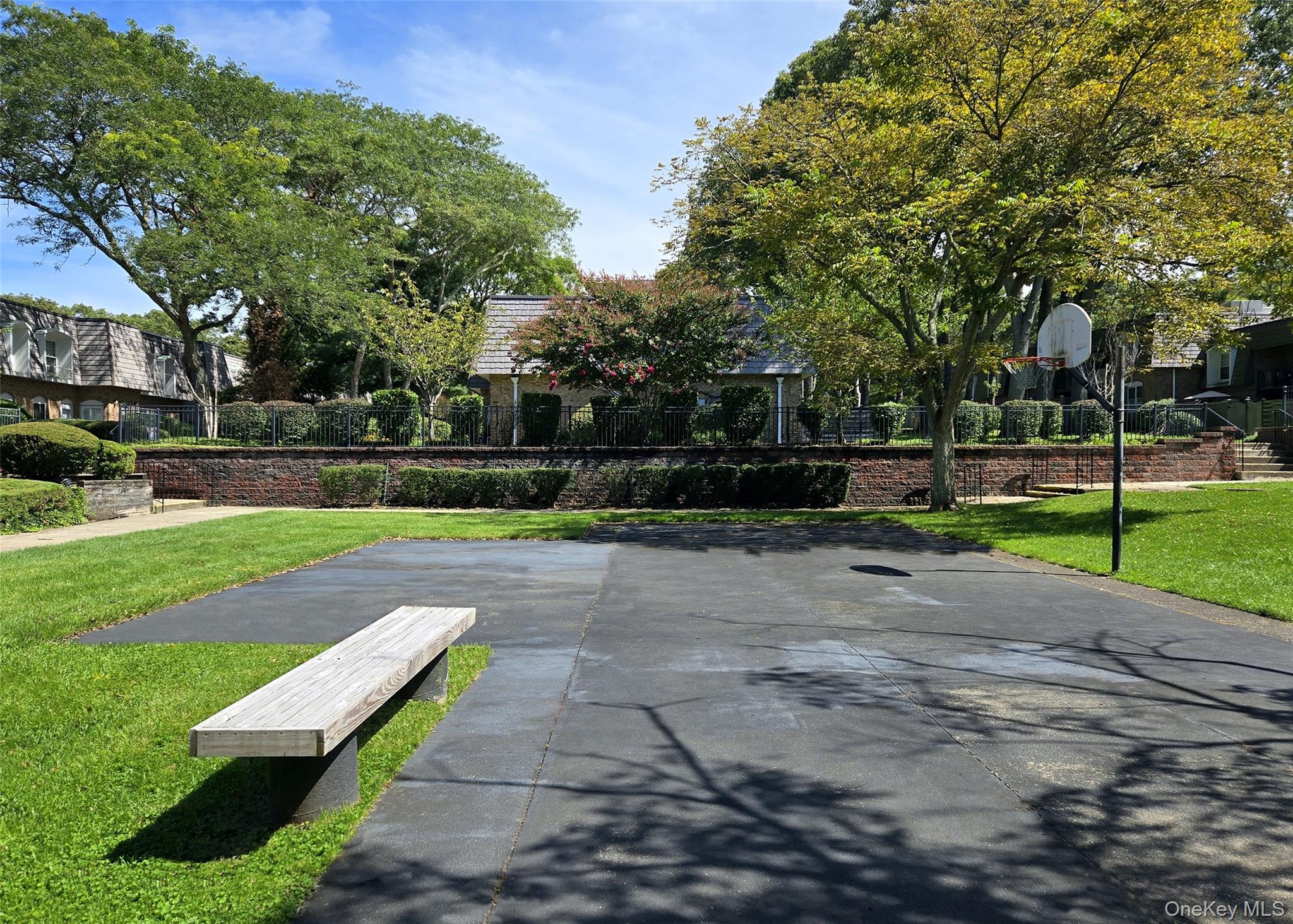 655 Middle Country Road, Unit 22E2 Coram, NY 11727 - Photo 16 of 16 a view of a park with large trees
