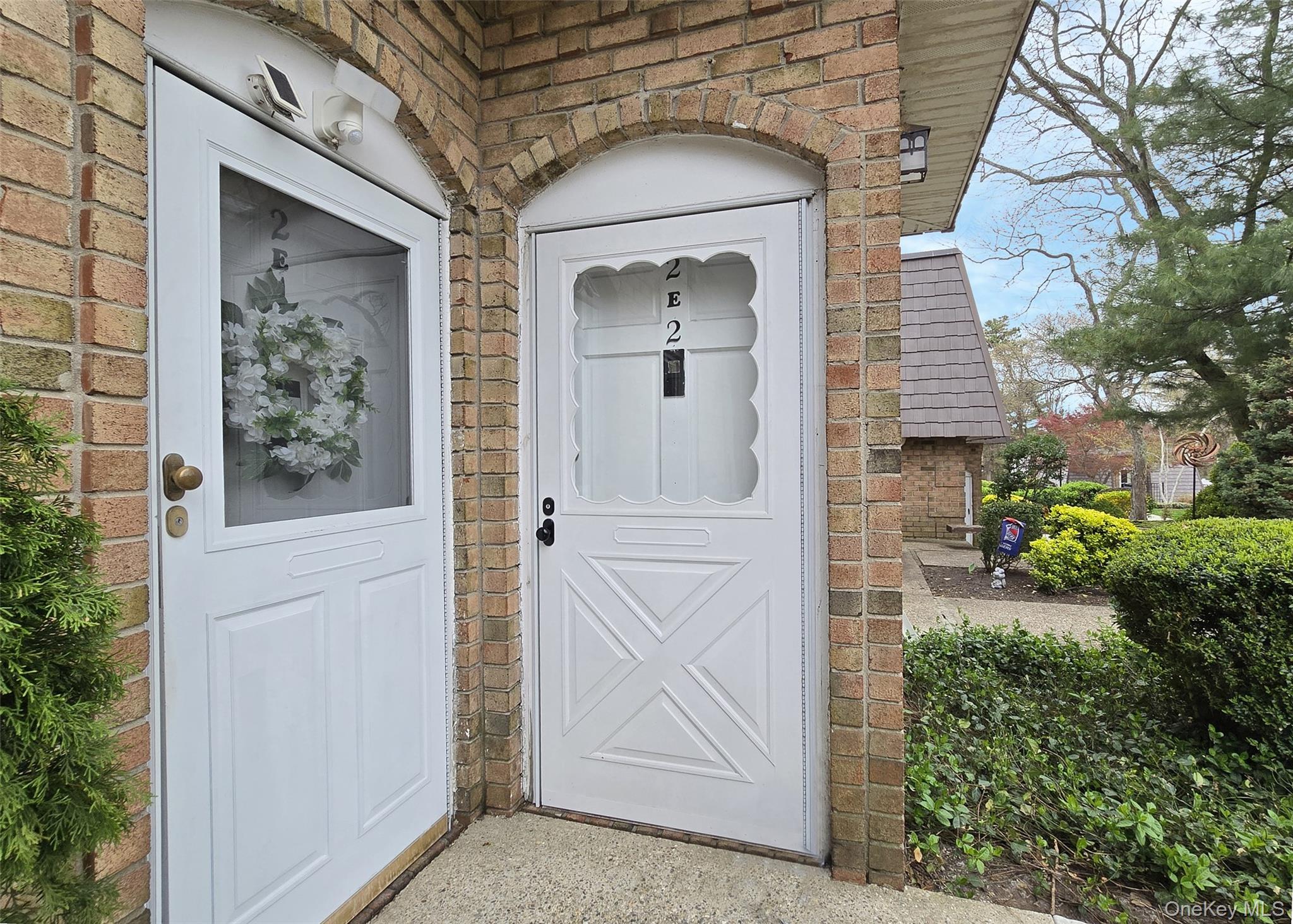 655 Middle Country Road, Unit 22E2 Coram, NY 11727 - Photo 2 of 16 a view of front door of a house
