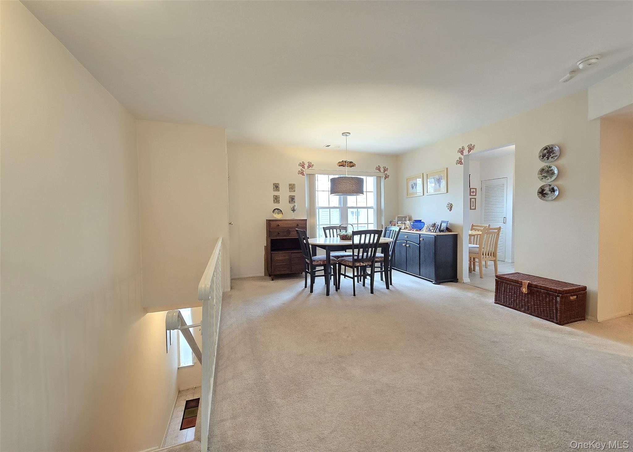 655 Middle Country Road, Unit 22E2 Coram, NY 11727 - Photo 8 of 16 a view of a livingroom with furniture and a window