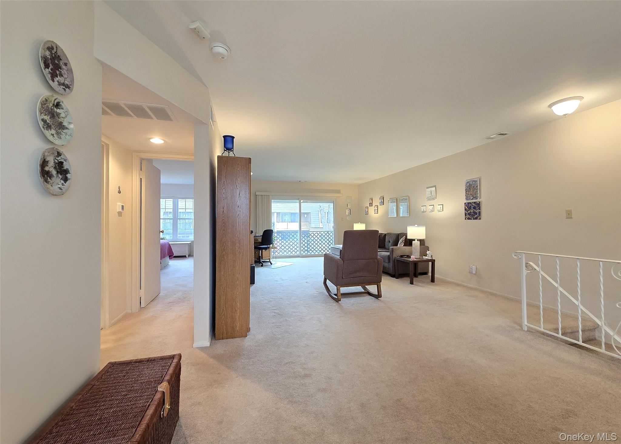 655 Middle Country Road, Unit 22E2 Coram, NY 11727 - Photo 9 of 16 a view of livingroom with furniture and a livingroom