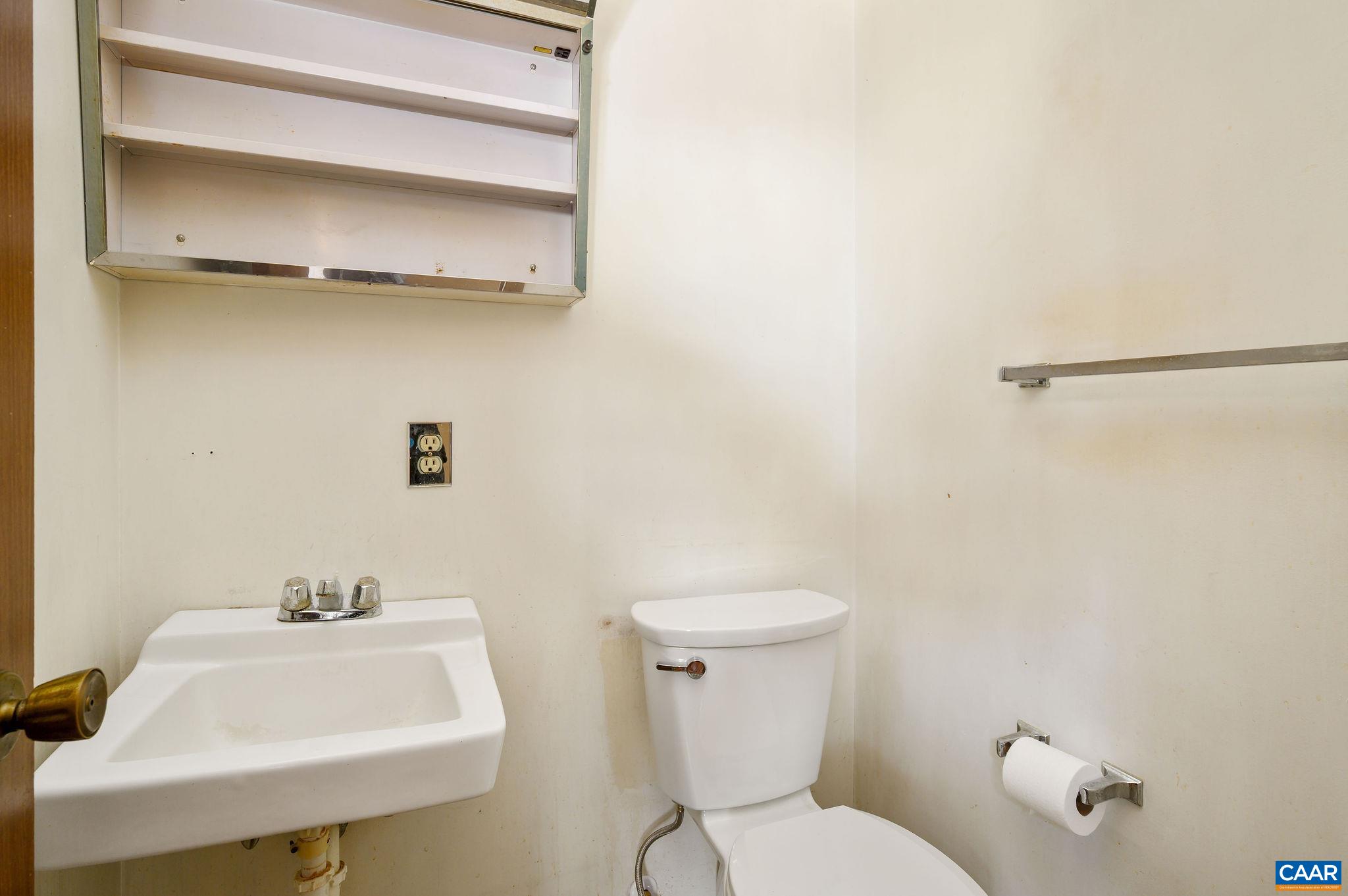 202 Hartmans Mill Road Charlottesville, VA 22902 - Photo 11 of 27 a bathroom with a sink a toilet and a mirror