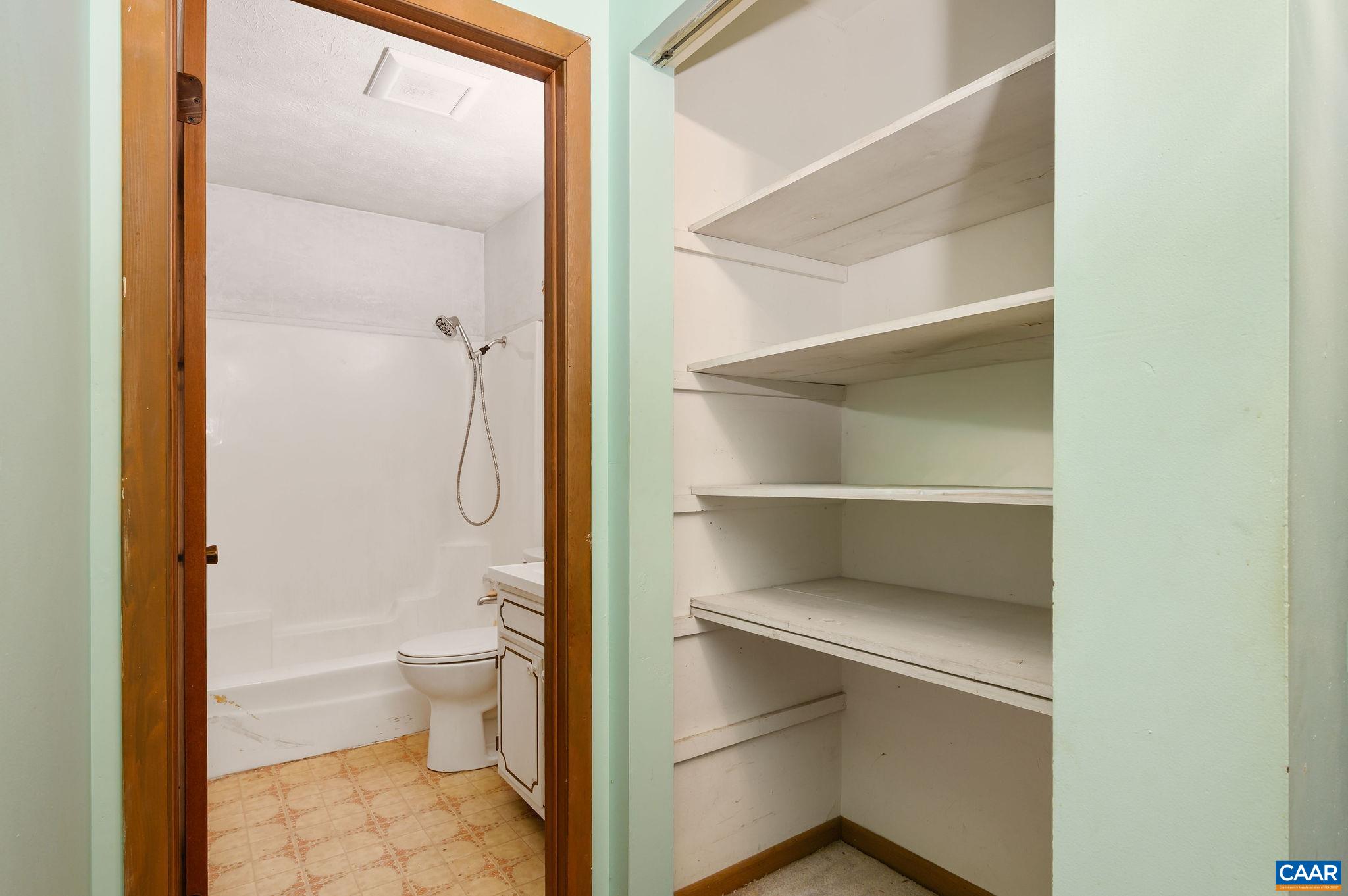 202 Hartmans Mill Road Charlottesville, VA 22902 - Photo 14 of 27 a bathroom with a toilet and a shower