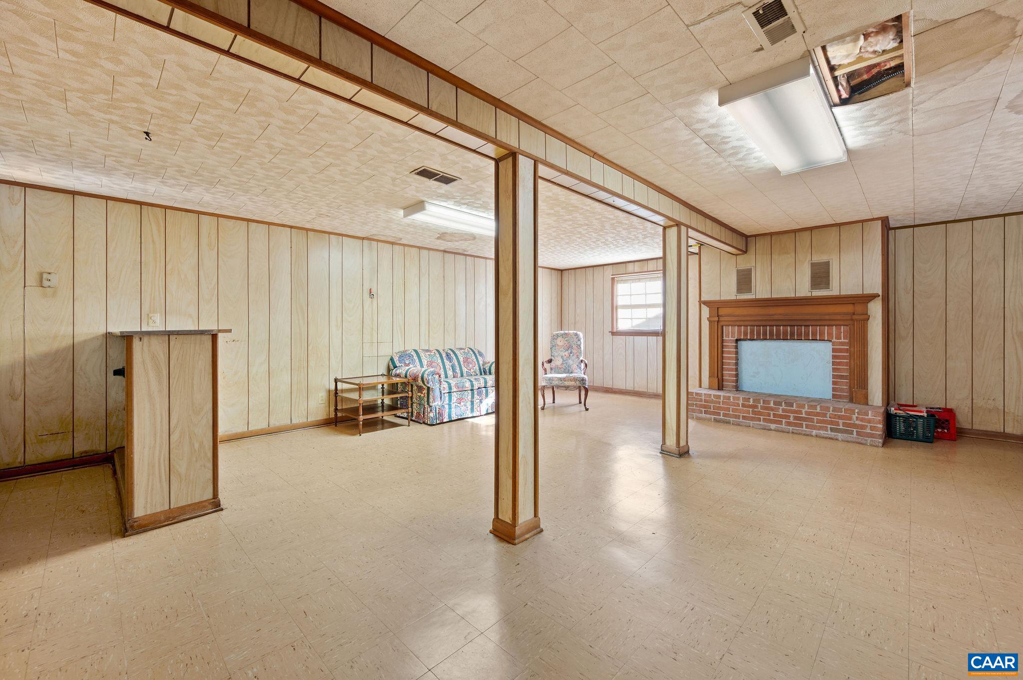 202 Hartmans Mill Road Charlottesville, VA 22902 - Photo 15 of 27 a view of a livingroom with furniture and a fireplace