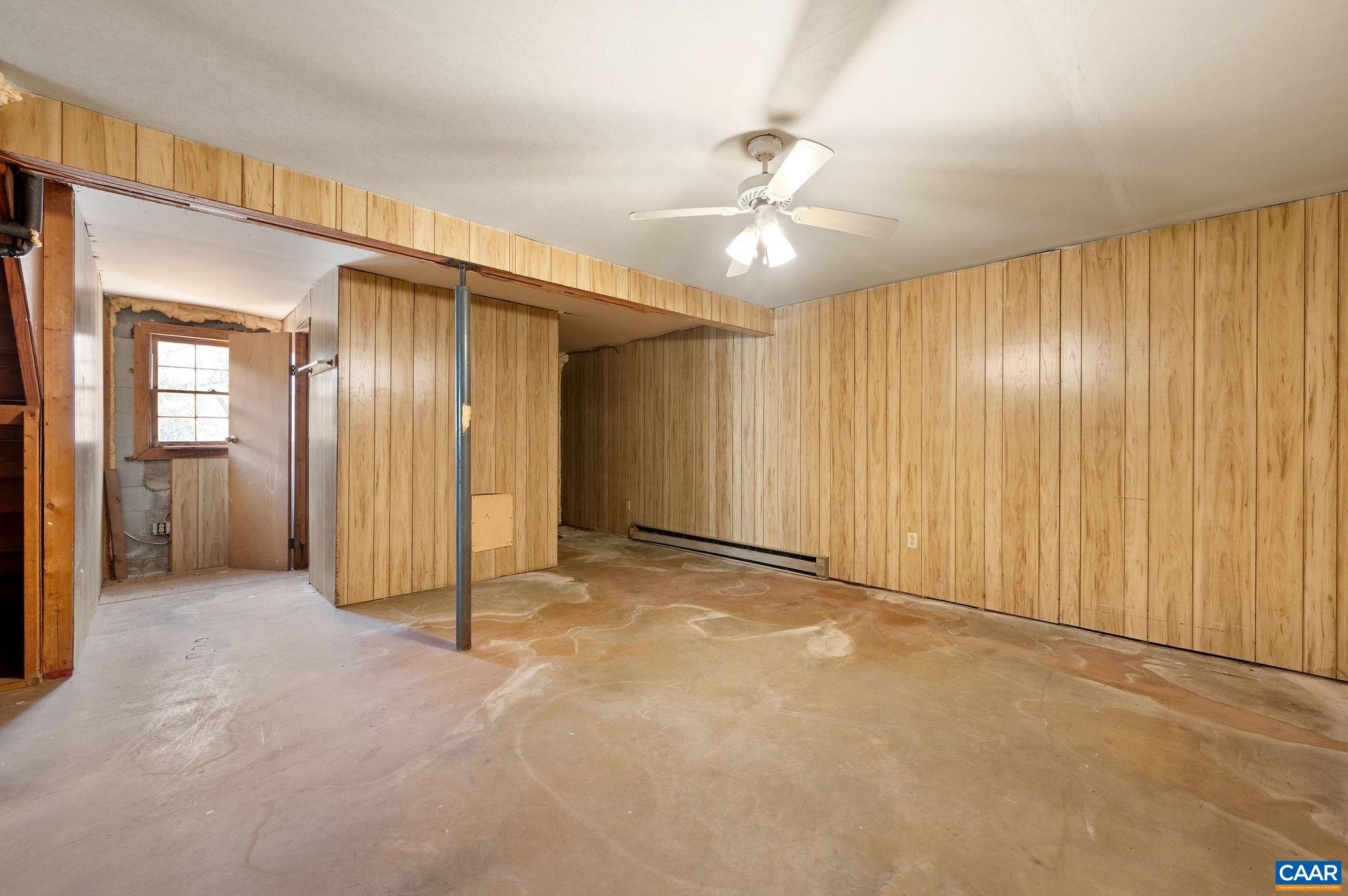 202 Hartmans Mill Road Charlottesville, VA 22902 - Photo 16 of 27 an empty room with fan and entrance