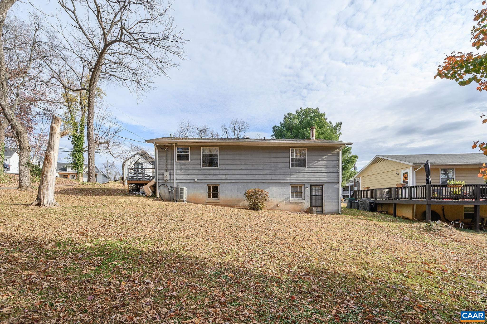 202 Hartmans Mill Road Charlottesville, VA 22902 - Photo 21 of 27 a front view of a house with a yard covered in snow