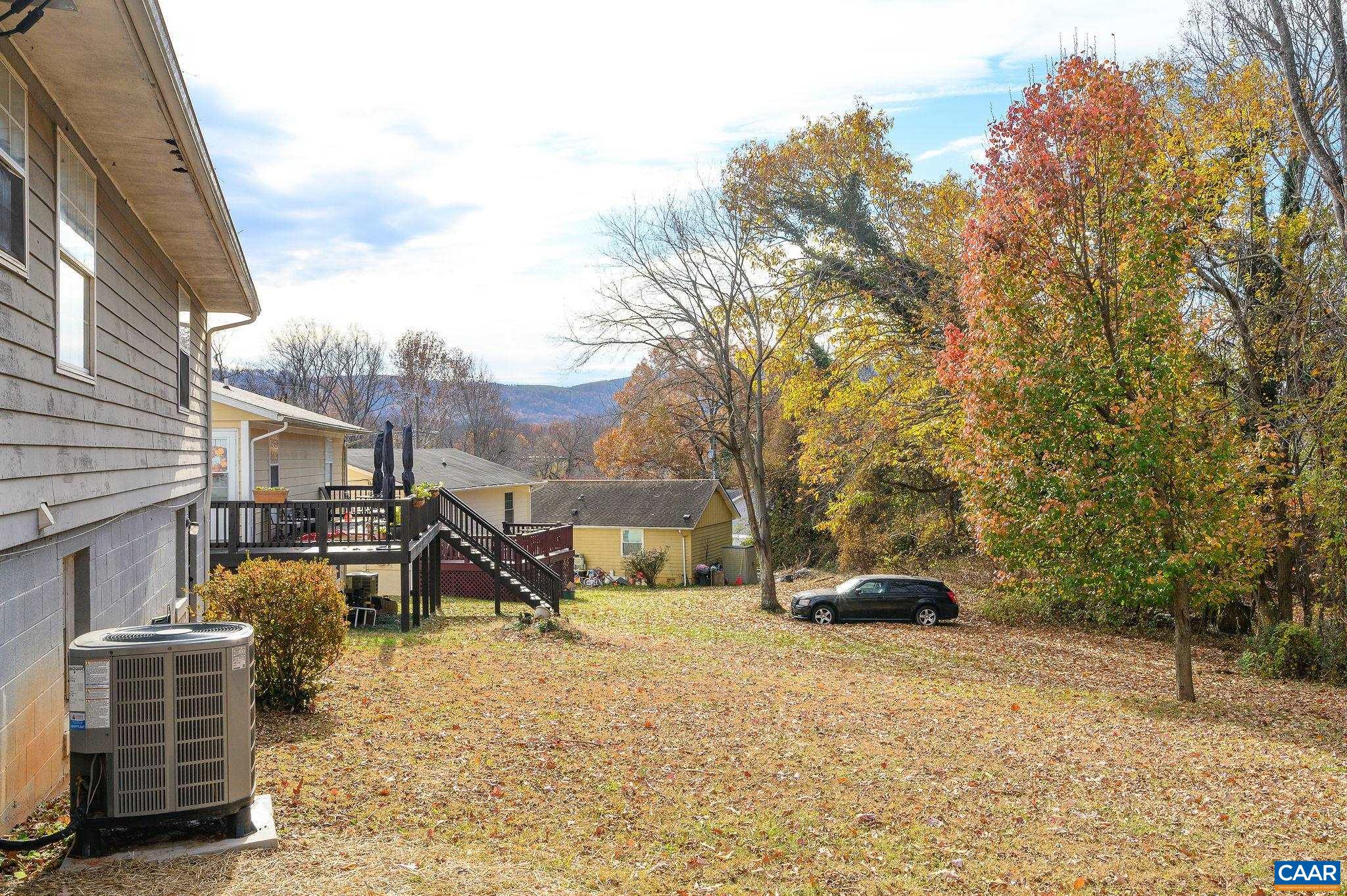 202 Hartmans Mill Road Charlottesville, VA 22902 - Photo 23 of 27 a view of a park with bench and trees