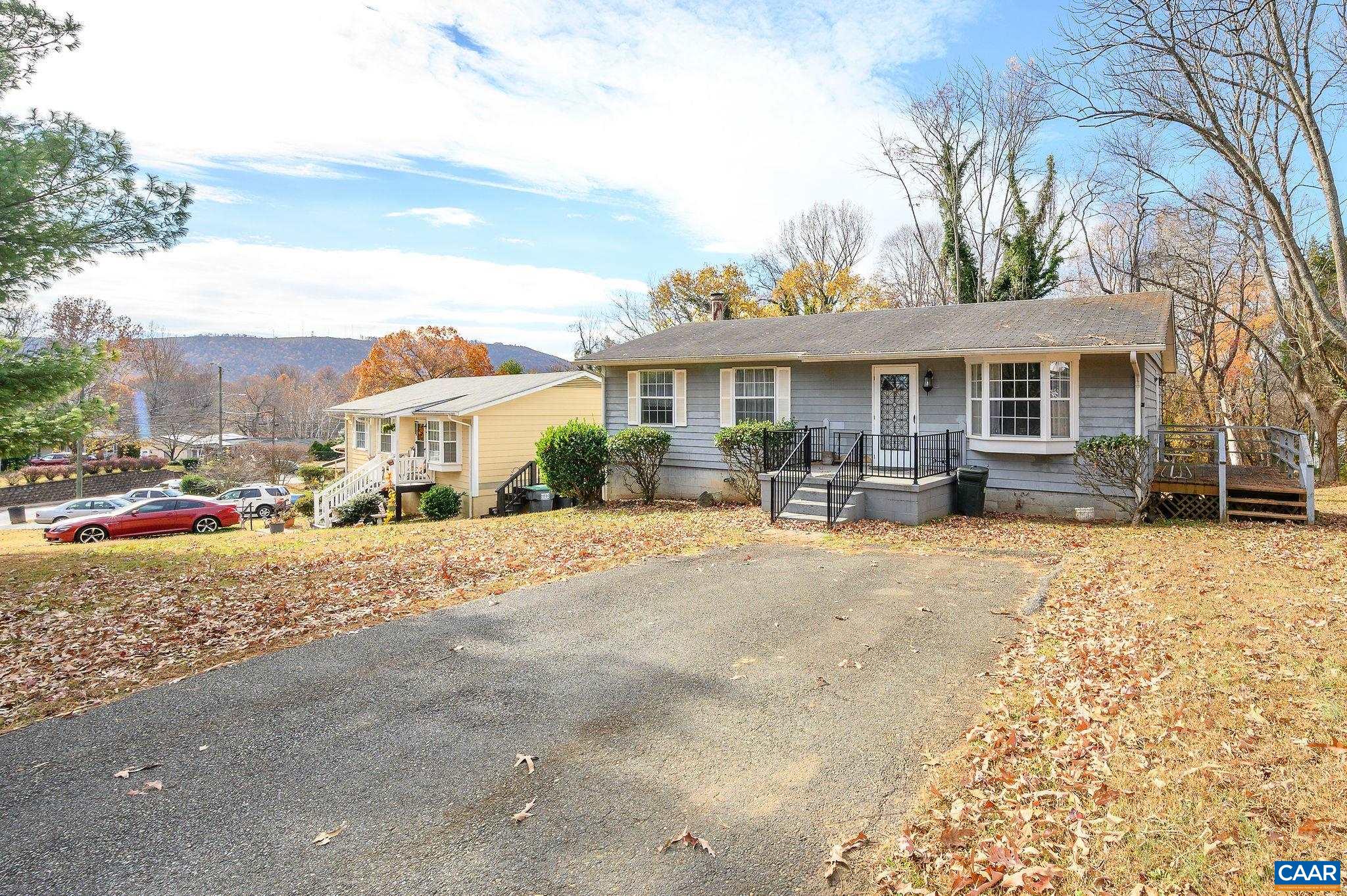 202 Hartmans Mill Road Charlottesville, VA 22902 - Photo 3 of 27 a front view of a house with basket ball court and outdoor seating