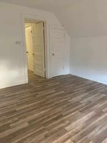 a backyard of a house with oven and tree