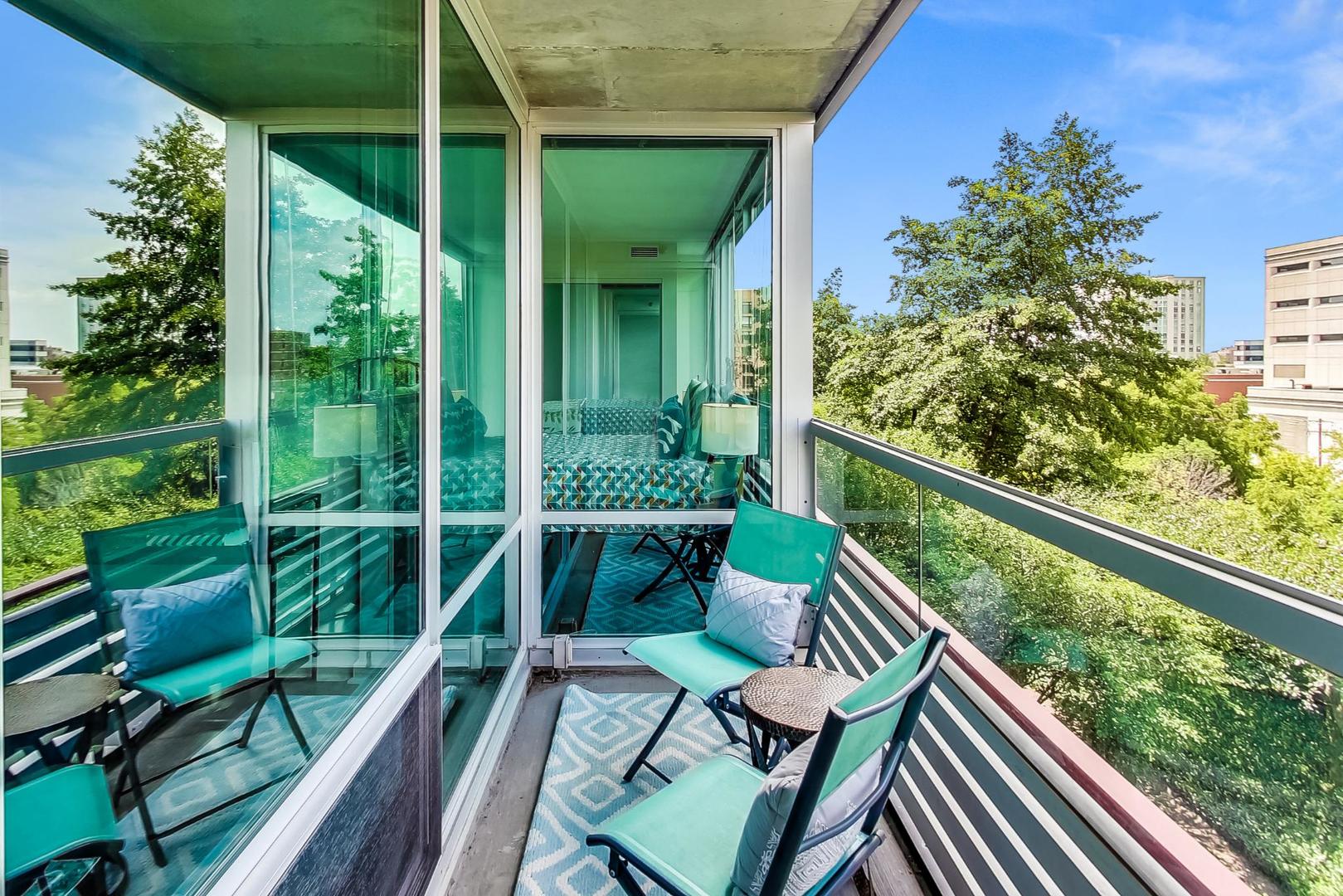 800 Elgin Road, Unit 702 Evanston, IL 60201 - Photo 14 of 16 a balcony with chairs