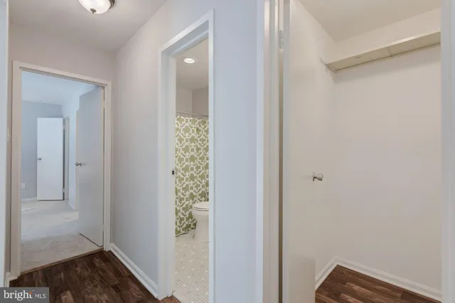 a view of front door with wooden floor