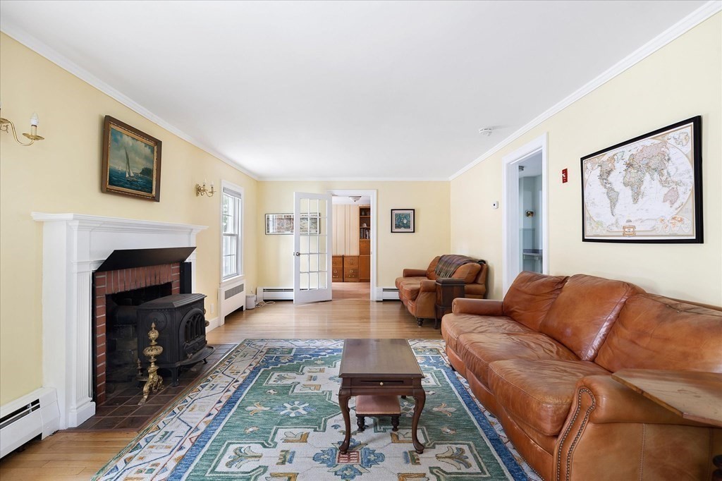 5 West Sutton Road Sutton, MA 01590 - Photo 11 of 36 a living room with furniture and a fireplace
