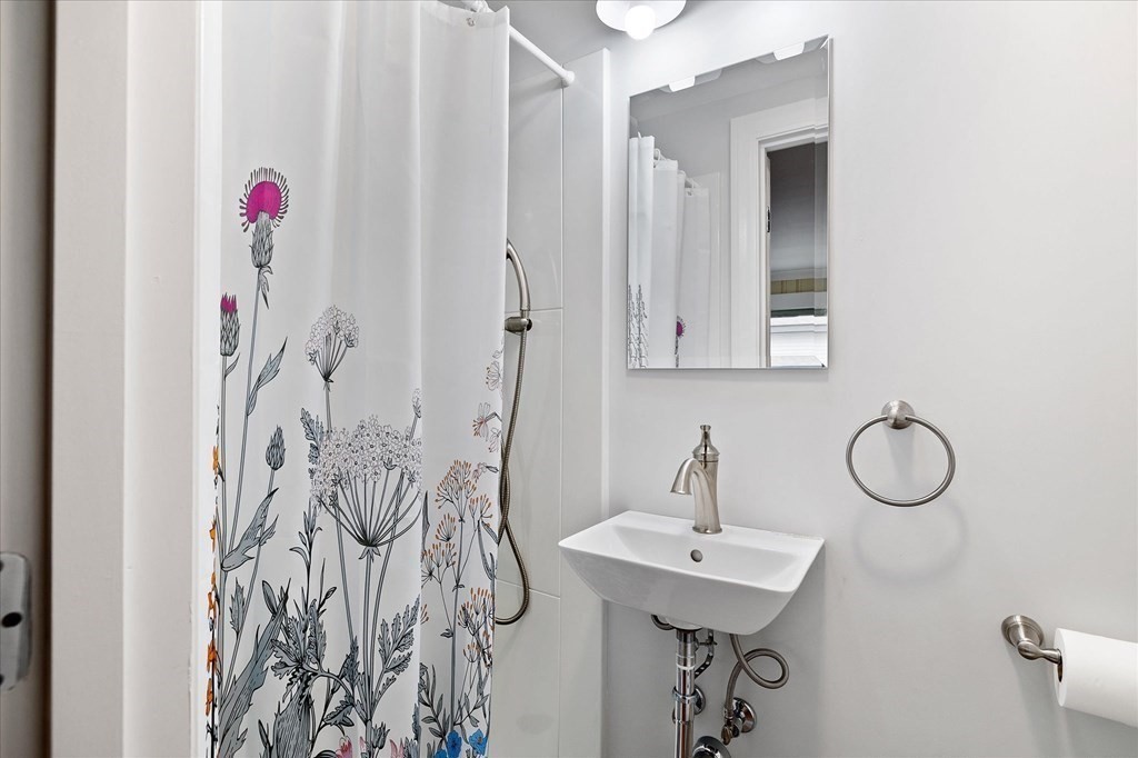 5 West Sutton Road Sutton, MA 01590 - Photo 19 of 36 a bathroom with a sink and mirror with vanity