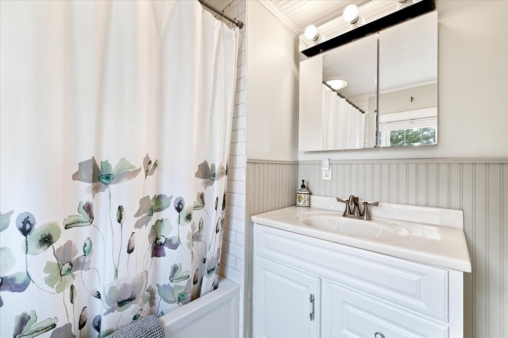 5 West Sutton Road Sutton, MA 01590 - Photo 26 of 36 a bathroom with a sink and a mirror