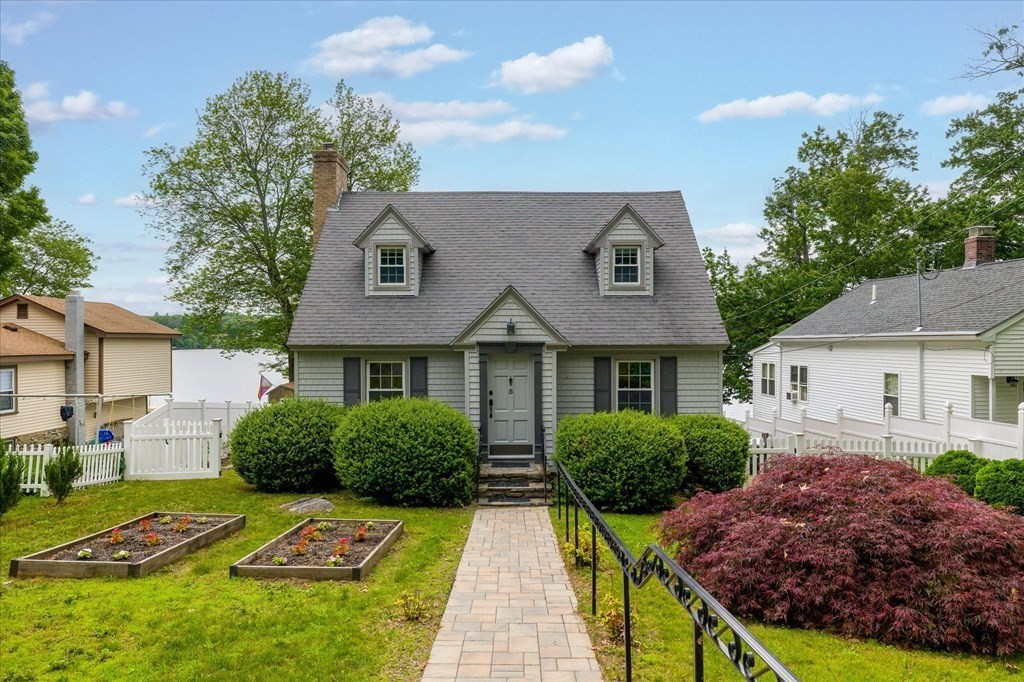 5 West Sutton Road Sutton, MA 01590 - Photo 3 of 36 a front view of house with yard and green space