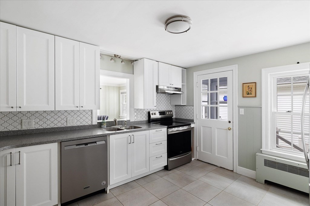 5 West Sutton Road Sutton, MA 01590 - Photo 5 of 36 a kitchen with a sink stove and cabinets