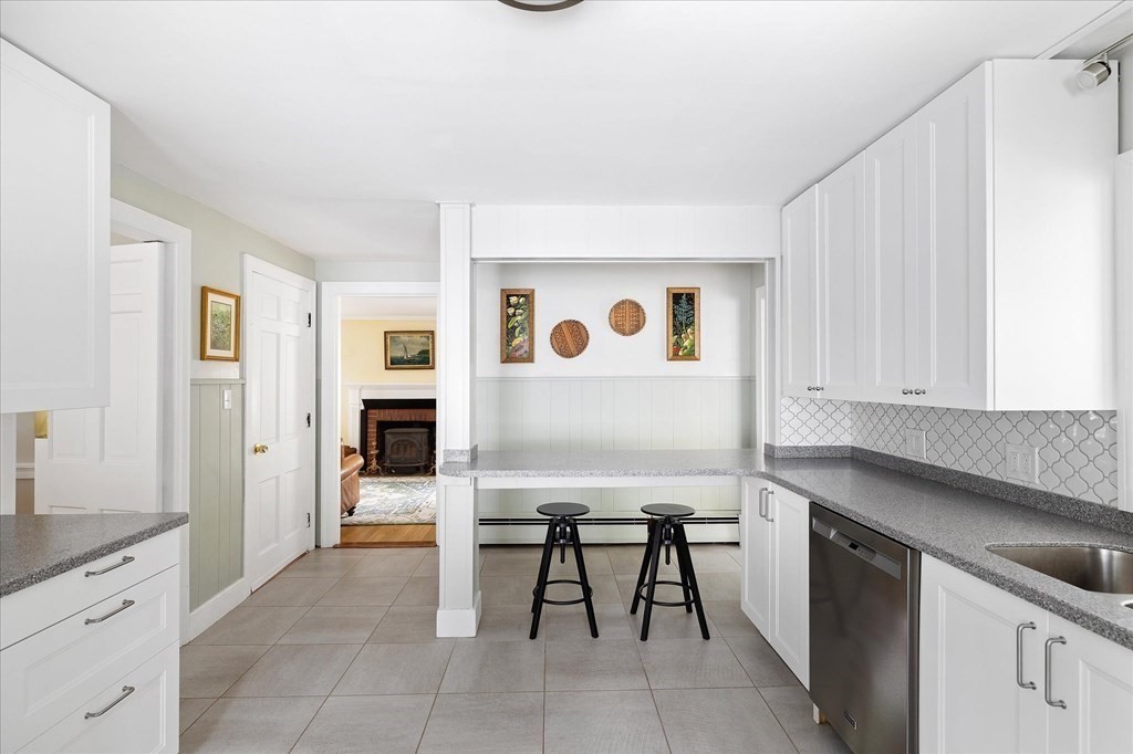 5 West Sutton Road Sutton, MA 01590 - Photo 8 of 36 a kitchen with stainless steel appliances granite countertop a sink and cabinets