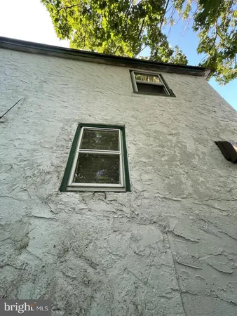 a brick building with a yard