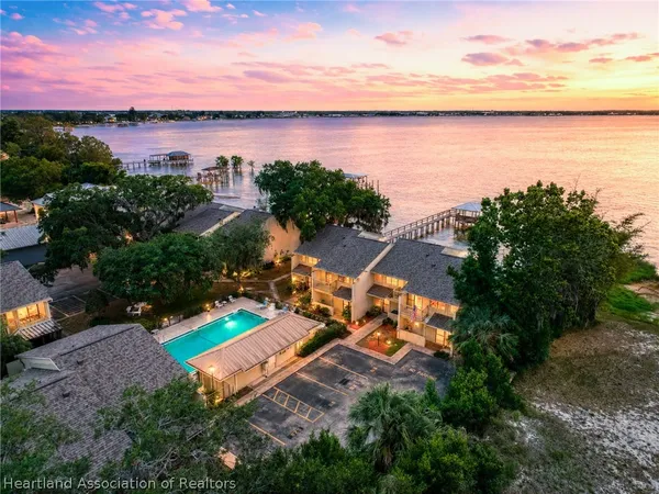 an aerial view of a house with a lake view