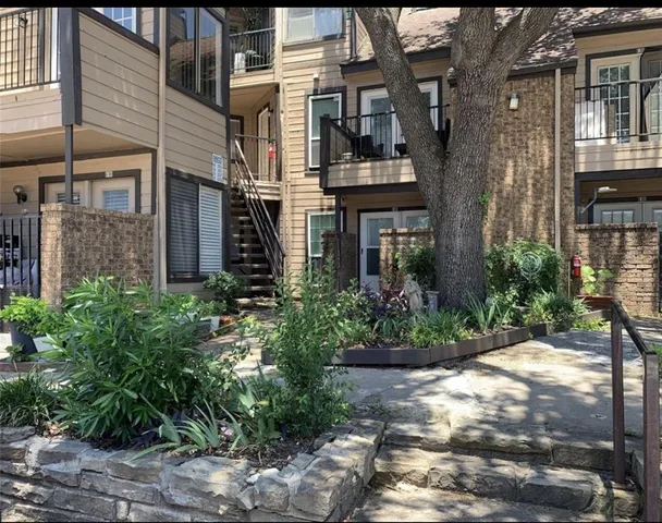 a view of a building with a garden