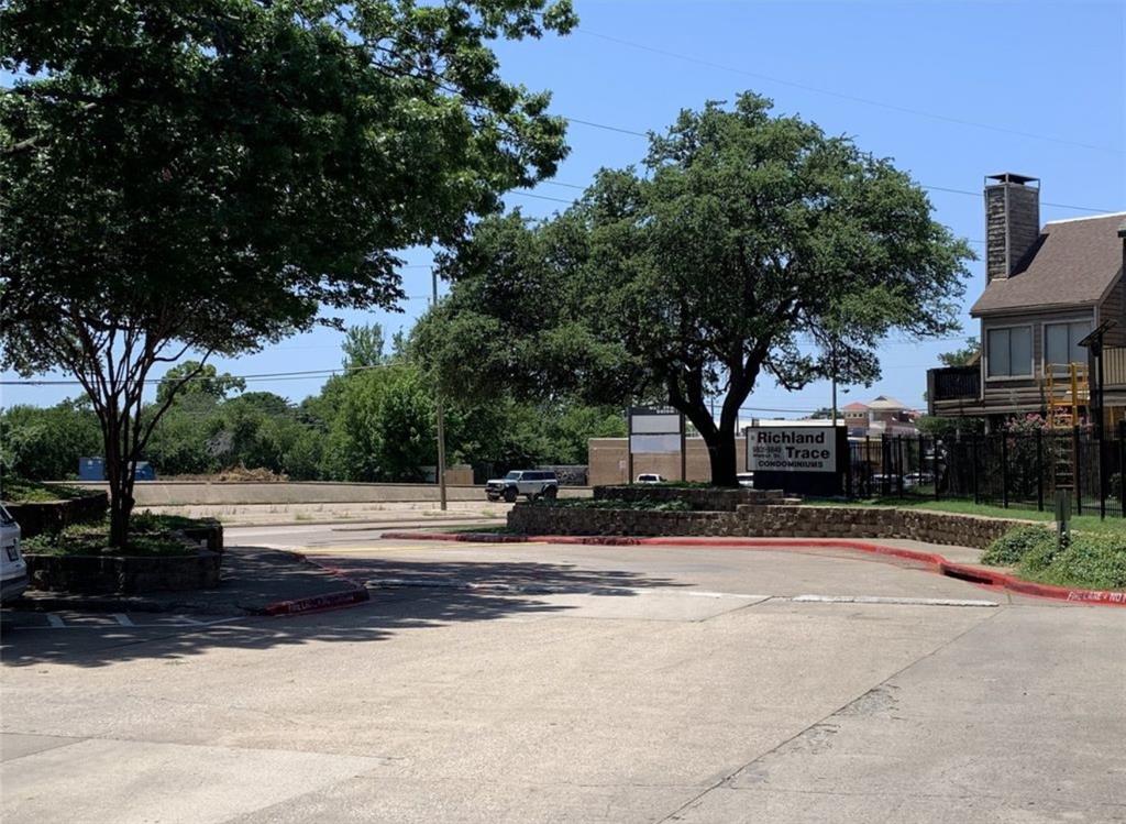 9803 Walnut Street, Unit 107 Dallas, TX 75243 - Photo 5 of 10 a view of street with houses