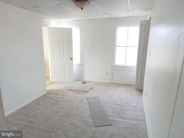 an empty room with windows