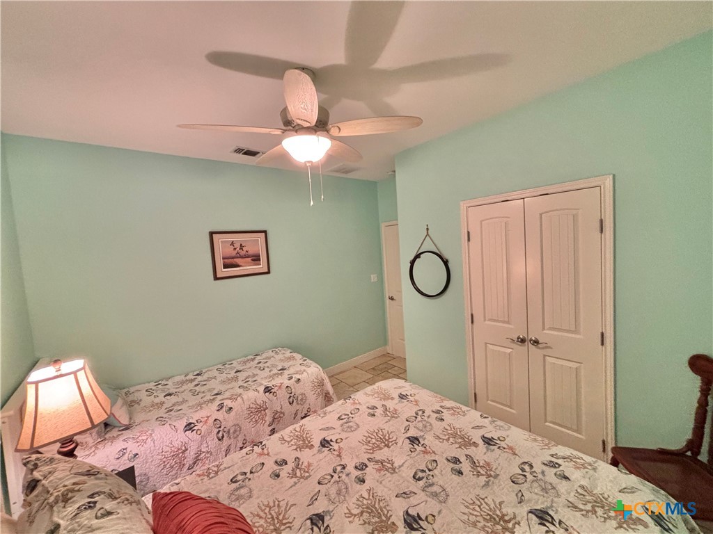 403 Maple Street Port O'Connor, TX 77982 - Photo 18 of 48 a bedroom with a bed and a window